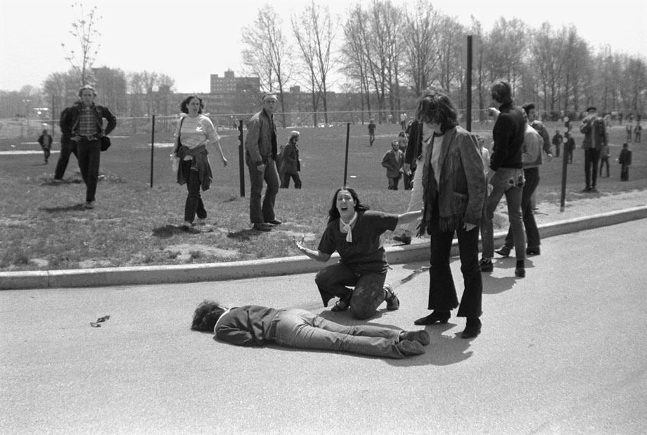 Mary Ann Vecchio screams as she kneels over the body of fellow s